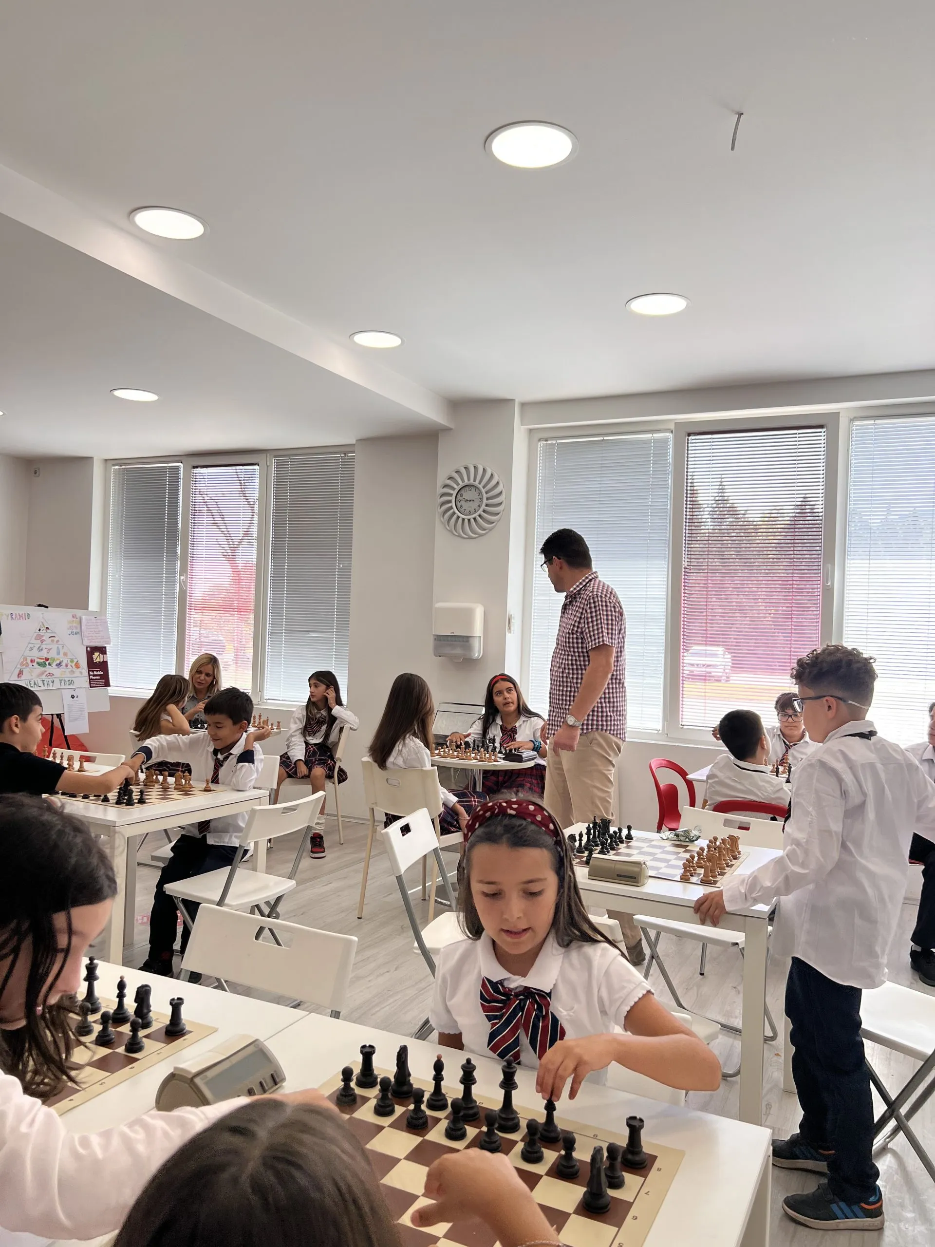 Uniformed students competing in a chess tournament