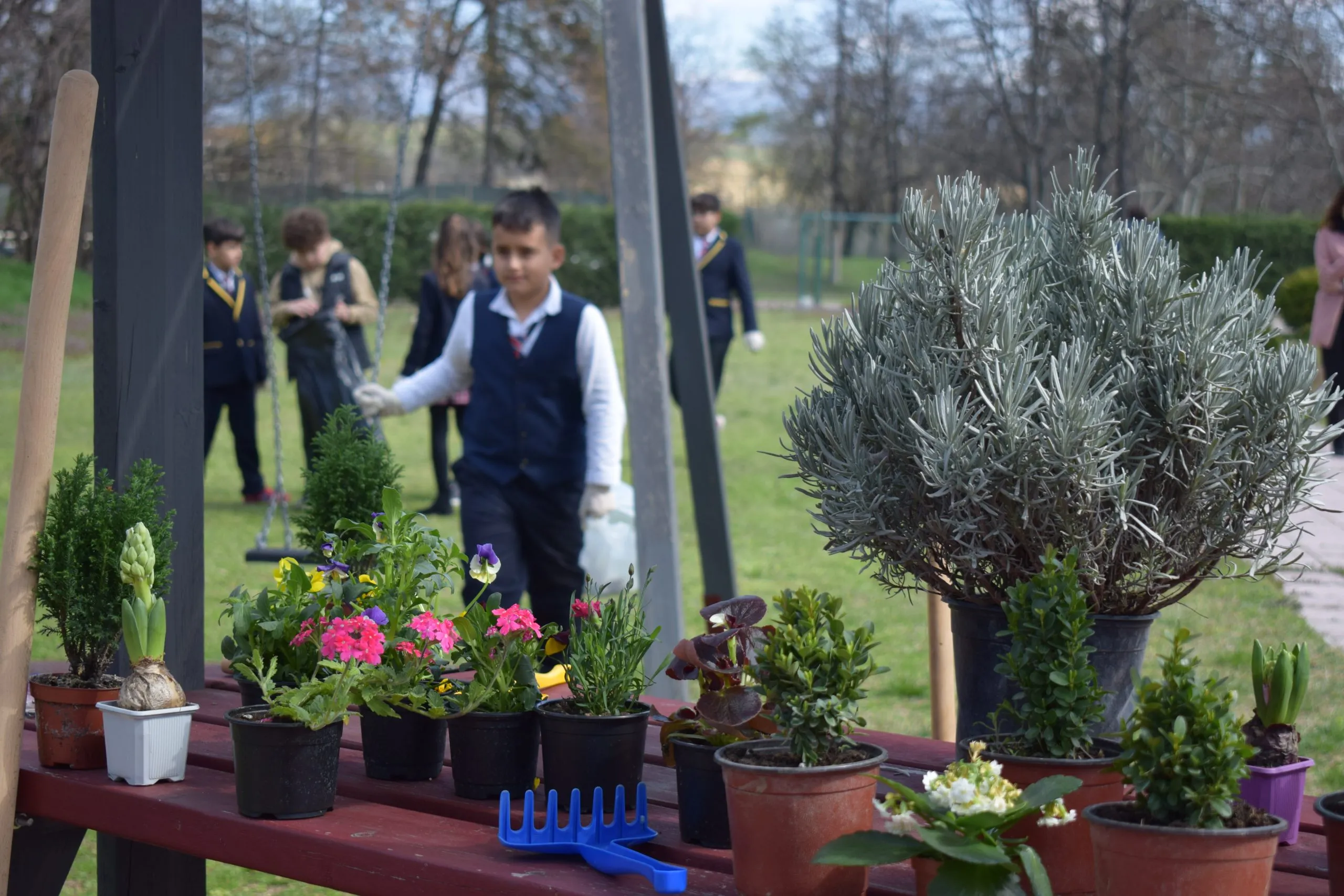 Students at an outdoor gardening lesson in the school garden