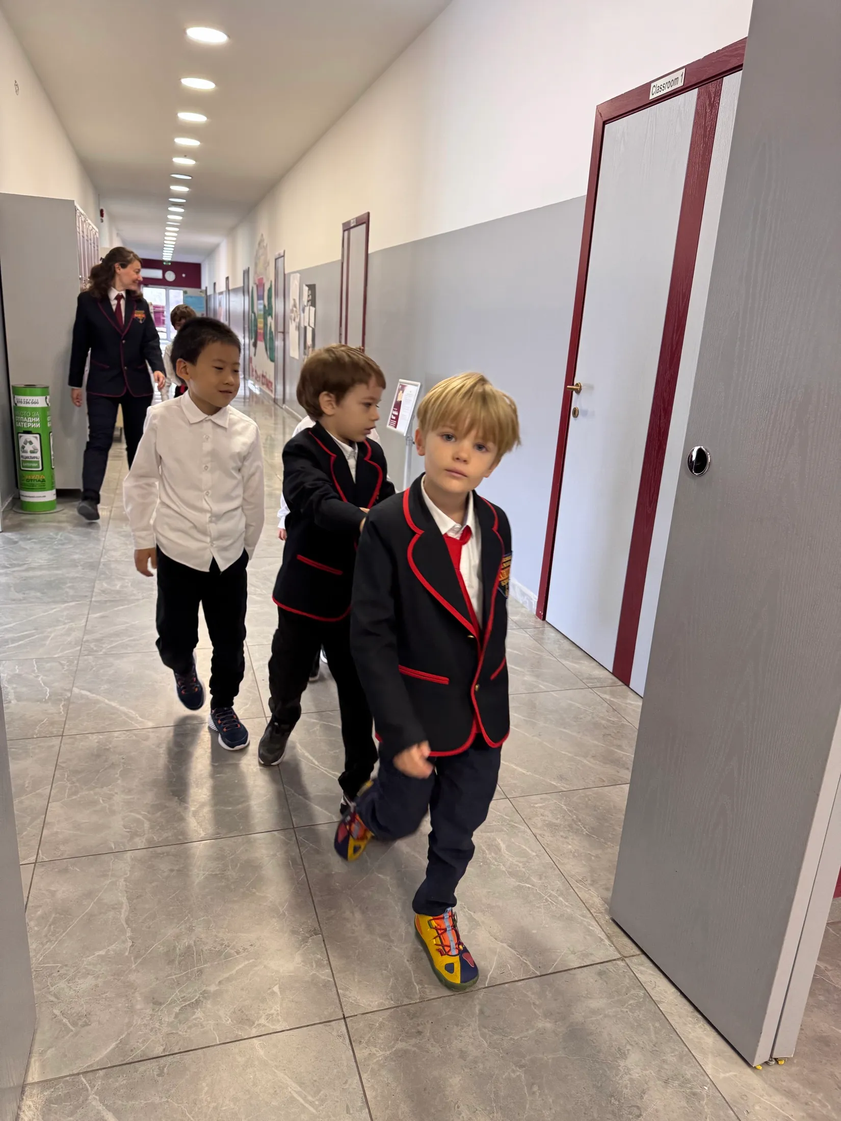 Three first graders heading back to Classroom 1